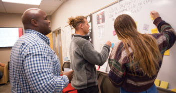 Courtney Carter (left) of the Office of Career and Professional Development encourages students to share employers of interest. (Photo by Coco McKown '04, '10)